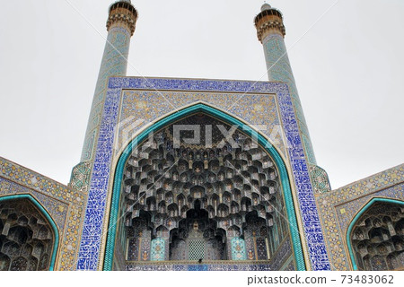 The exterior of Imam Mosque or The Shah Mosque. 17th Century. Unesco World Heritage Site. Low angle shot. The exterior of Imam Mosque or The Shah Mosque. 17th Century. Unesco World Heritage Site. Low angle shot. 73483062