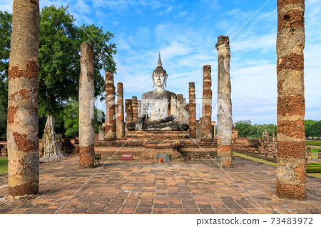 Buddha statue in ruined chapel in monastery complex at Wat Mahathat temple, Sukhothai Historical Park, Thailand 73483972