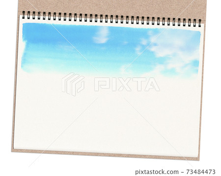 Sketchbook on a white background depicting the sky with watercolors Sketchbook on a white background depicting the sky with watercolors 73484473