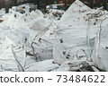 White bags with paving stones for the construction works 73484622