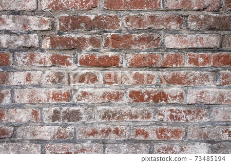 Old building brick wall faded with lime material Old building brick wall faded with lime material 73485194