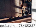 Old Soviet respirator for respiratory protection on the handicap of an old sunlit room. The concept of protection against coronavirus infection 73485287