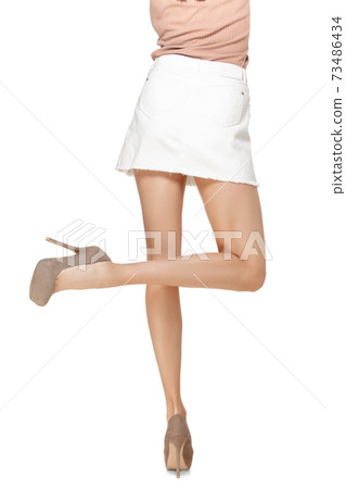 Shapely female legs in stilettos isolated on white background. Back view. 73486434