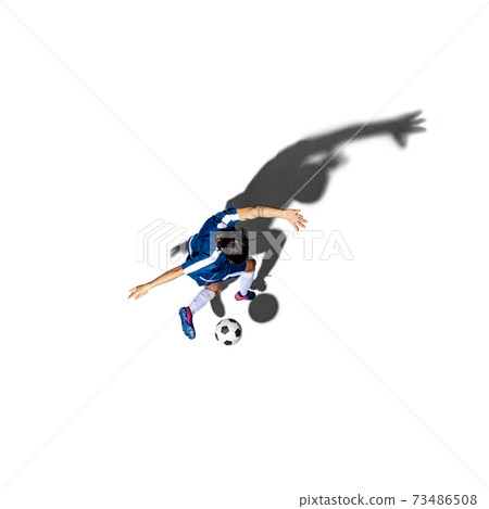 Top view of young man soccer player isolated over white background with shadow. 73486508