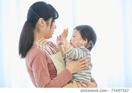 Smiley child and nursery teacher Smiley child and nursery teacher 73487567