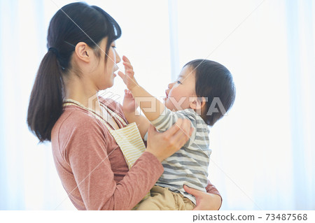 Smiley child and nursery teacher Smiley child and nursery teacher 73487568