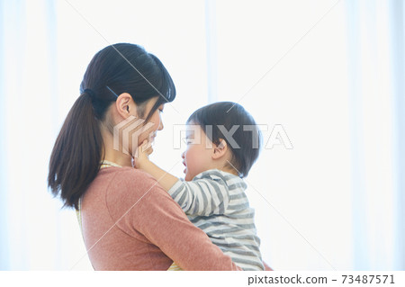 Smiley child and nursery teacher Smiley child and nursery teacher 73487571