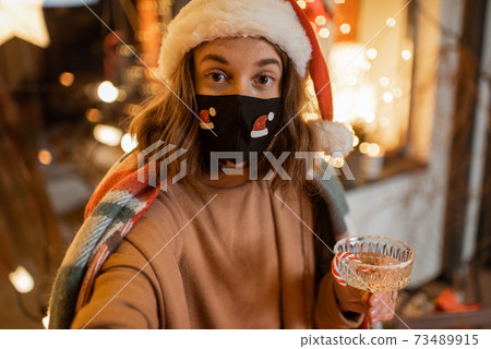 Woman on self-isolation celebrating New Year holidays at home Woman on self-isolation celebrating New Year holidays at home 73489915