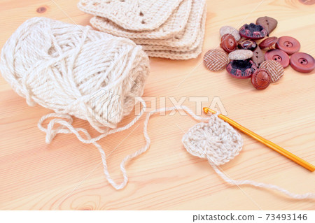 Brown buttons and tweed thread 73493146