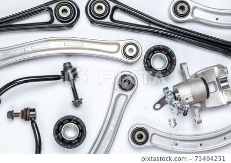 Car construct. Set of new metal car part. Auto motor mechanic spare or automotive piece isolated on white background. Automobile engine service with space for text. Car construct. Set of new metal car part. Auto motor mechanic spare or automotive piece isolated on white background. Automobile engine service with space for text. 73494251