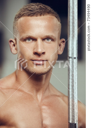 Closeup portrait of a handsome man at gym Closeup portrait of a handsome man at gym 73494490