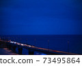 Night view of the road on the sea 73495864