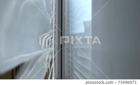 extreme close-up, detailed. view between iron blinds and window extreme close-up, detailed. view between iron blinds and window 73496971