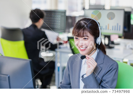 Young woman working in a call center Young woman working in a call center 73497998