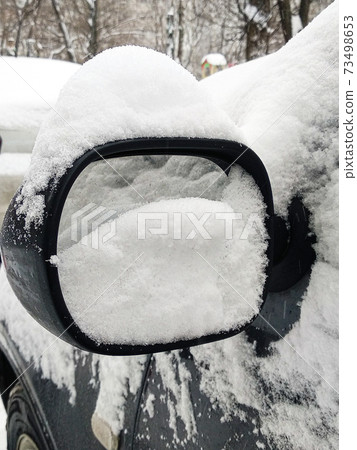 Car mirror in the snow. The problem of the winter season. Car mirror in the snow. The problem of the winter season. 73498653