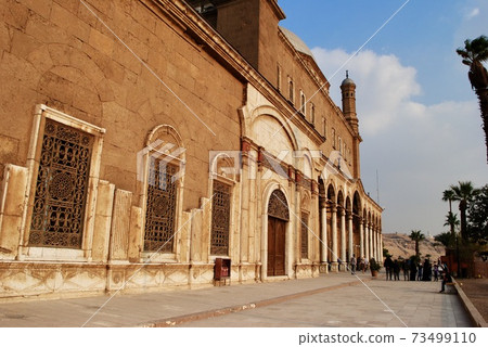Cairo Egypt. Circa Dec. 2019. Tourists visit the Great Mosque of Muhammad Ali Pasha or Alabaster Mosque dated back to 19th century, adjacent to the Cairo Citadel. UNESCO World Heritage Site. 73499110