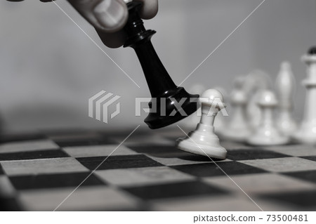 The king knocks over a pawn. 73500481