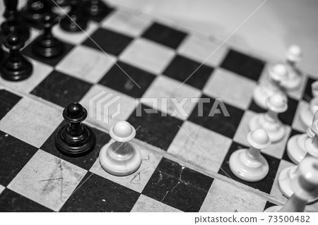 Old chess on an old chessboard. 73500482