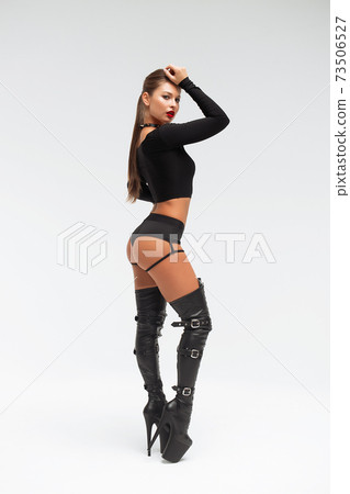 Slim woman in sexy lingerie and boots 73506527