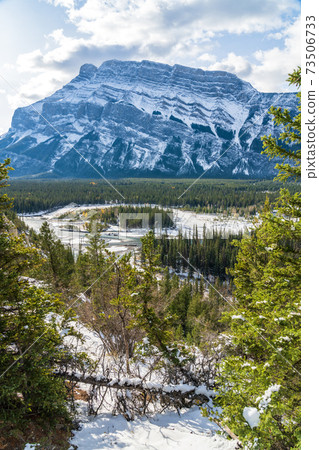 Banff National Park beautiful mountain landscape. Panorama view Mount Rundle valley forest and Bow River in snowy autumn sunny day. Hoodoos Viewpoint, Canadian Rockies. 73506733