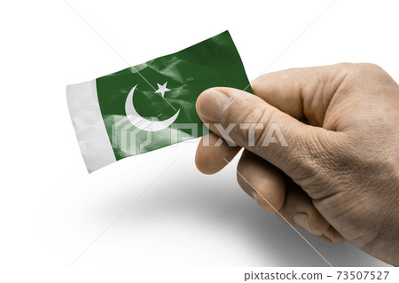 Hand holding a card with a national flag the Pakistan Hand holding a card with a national flag the Pakistan 73507527