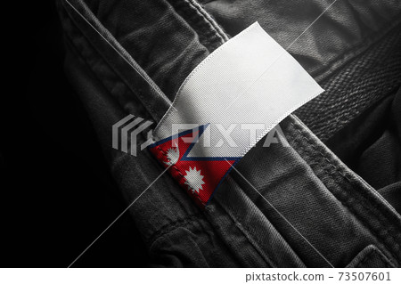 Tag on dark clothing in the form of the flag of the Nepal 73507601