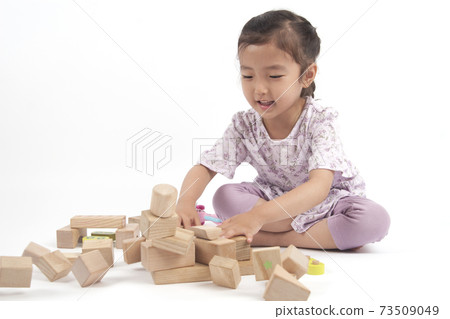 A toddler plays with blocks. A toddler plays with blocks. 73509049
