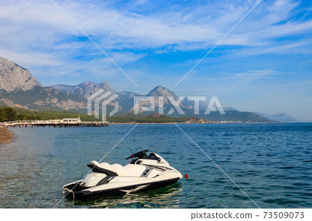 Empty jet ski on a blue sea of Kemer, Turkey. Summer vacation concept Empty jet ski on a blue sea of Kemer, Turkey. Summer vacation concept 73509073