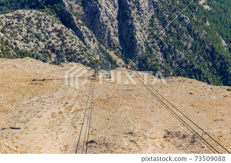 Cable car on ropeway leading to a top of Tahtali mountain in Antalya province, Turkey Cable car on ropeway leading to a top of Tahtali mountain in Antalya province, Turkey 73509088