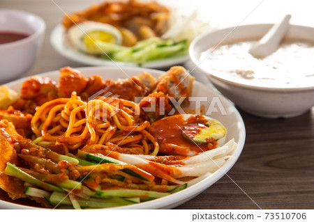 Mee Rojak is Malaysia Indian food of noodle with peanut sauce. Mee Rojak is Malaysia Indian food of noodle with peanut sauce. 73510706