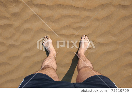 Bare feet in the sand Bare feet in the sand 73510799