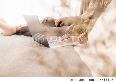 Asian Business Using Laptop Computer Online Working from Home Asian Business Using Laptop Computer Online Working from Home 73511106