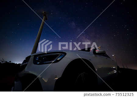 Foreign car and Milky Way 73512325