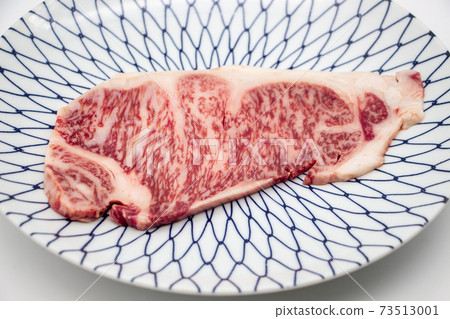 Saga beef sirloin steak on a Japanese plate Saga beef sirloin steak on a Japanese plate 73513001
