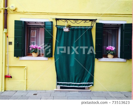 Yellow house and green window Yellow house and green window 73513623