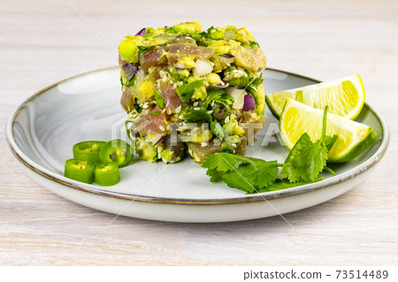 Seafood tuna fish ceviche salad avocado, lime, hot chili pepper, red onion, cilantro, sesame seeds Seafood tuna fish ceviche salad avocado, lime, hot chili pepper, red onion, cilantro, sesame seeds 73514489