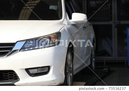 white car in garage for checking 73516237