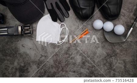 golf ball and accessories on floor 73516428