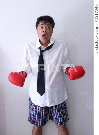 Business man wearing boxing glove loser Knock-out 73517340