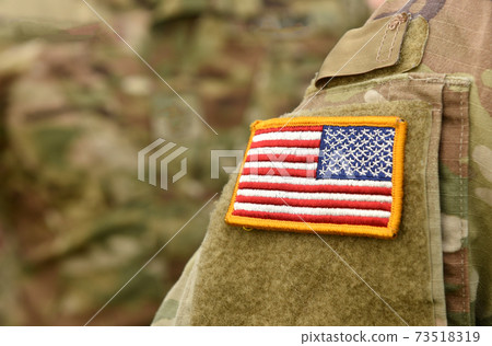 American Soldiers and Flag of USA on soldiers arm. US Army. Veterans Day American Soldiers and Flag of USA on soldiers arm. US Army. Veterans Day 73518319