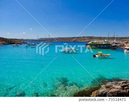 Blue Lagoon on Comino where the ship appears to float Blue Lagoon on Comino where the ship appears to float 73518471