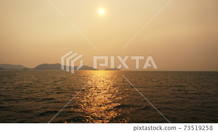 Sunset over the island of Chang overlooking sea. Sunset over the island of Chang overlooking sea. 73519258