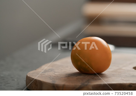 Lulo fruit on olive wood board on kitchen countertop 73520458