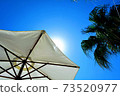 Blue sky and umbrella 73520977