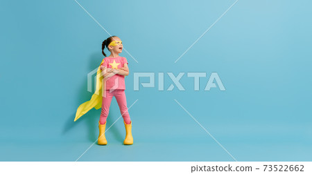 child playing superhero 73522662