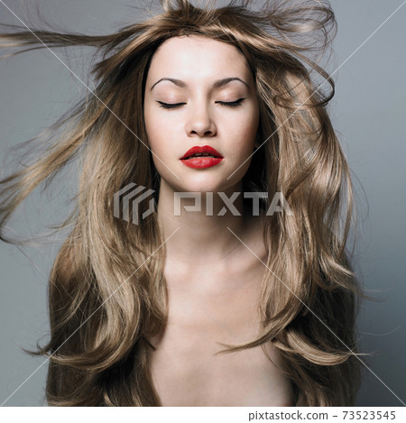 Sexy young woman with blonde hairs Sexy young woman with blonde hairs 73523545