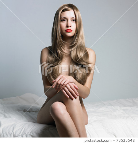Sexy young woman with blonde hairs Sexy young woman with blonde hairs 73523548