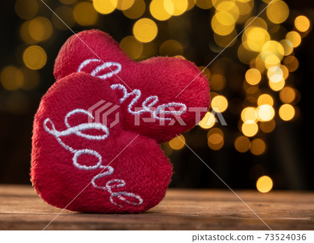 Heart shape on brown wood table with yellow light bokeh backgrounds Heart shape on brown wood table with yellow light bokeh backgrounds 73524036