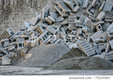 Waste from block walls removed during exterior demolition work 73524967