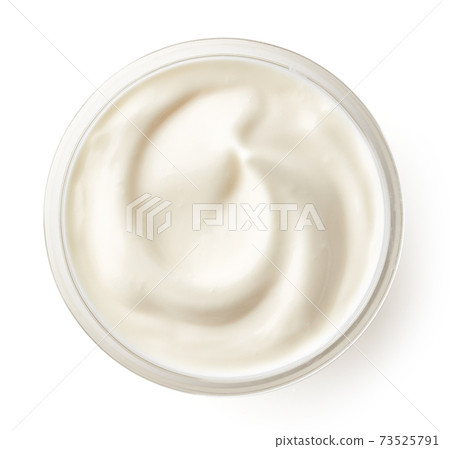 Cream in glass bowl isolated on white, top view Cream in glass bowl isolated on white, top view 73525791